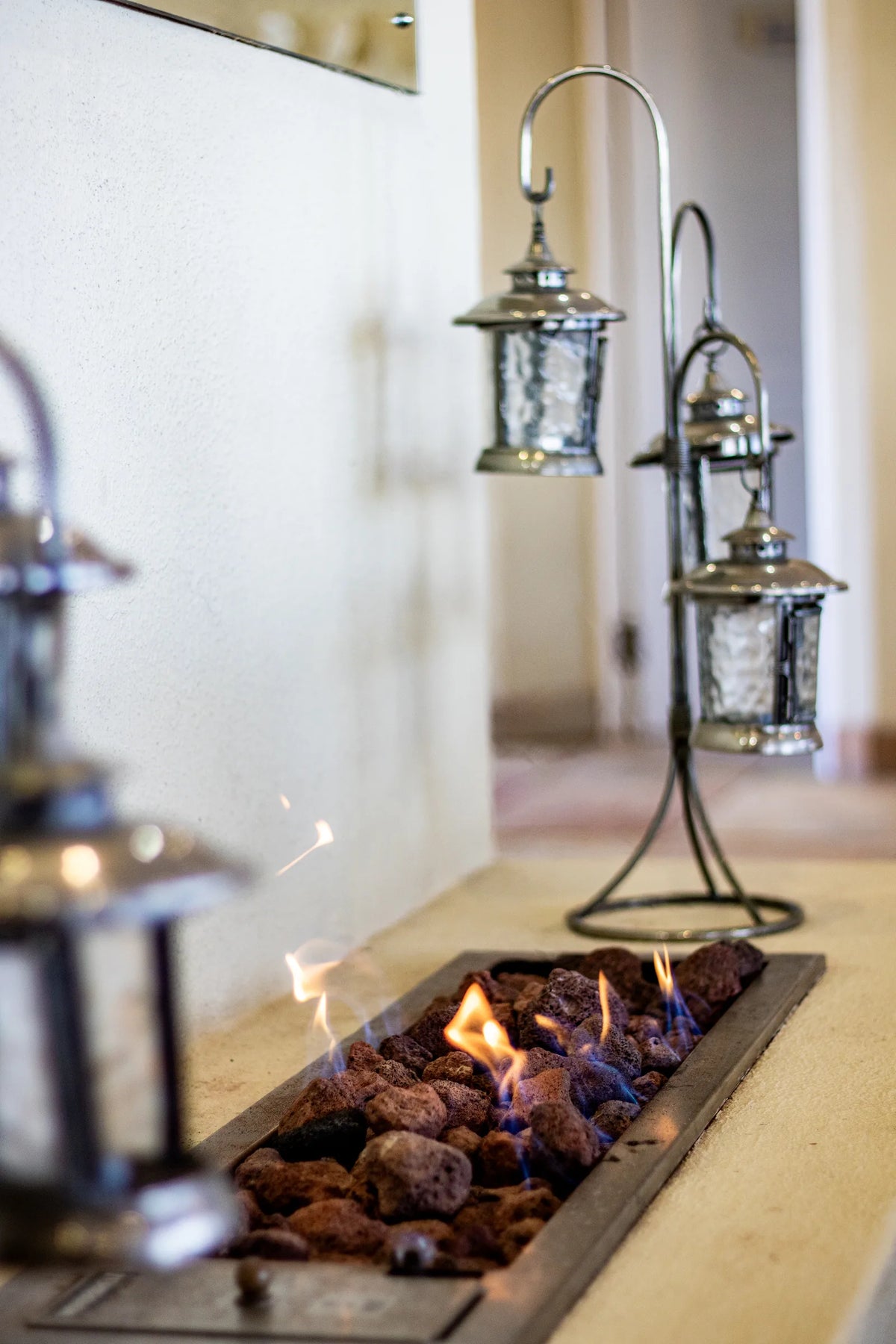 The gas fireplace in the living room, lit
