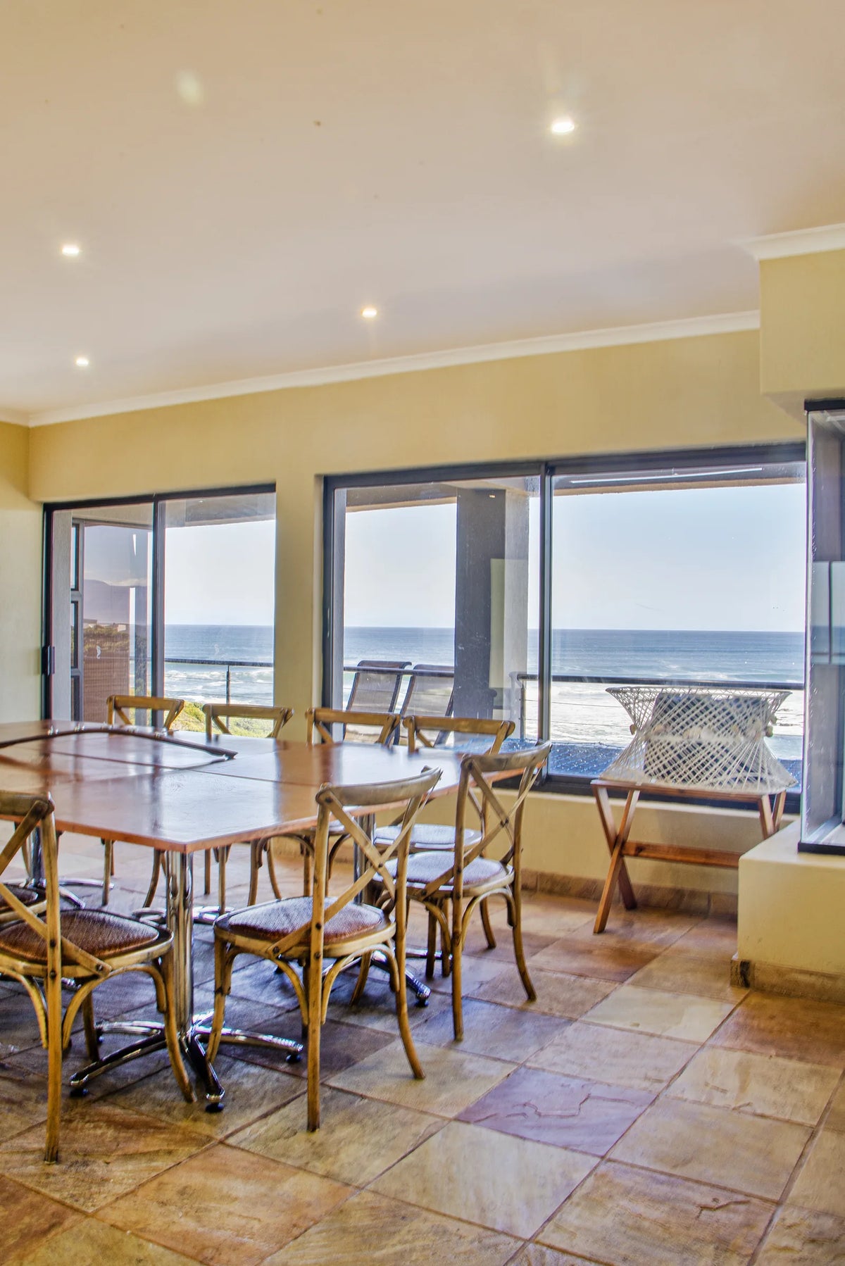 The dining table set against the sea view
