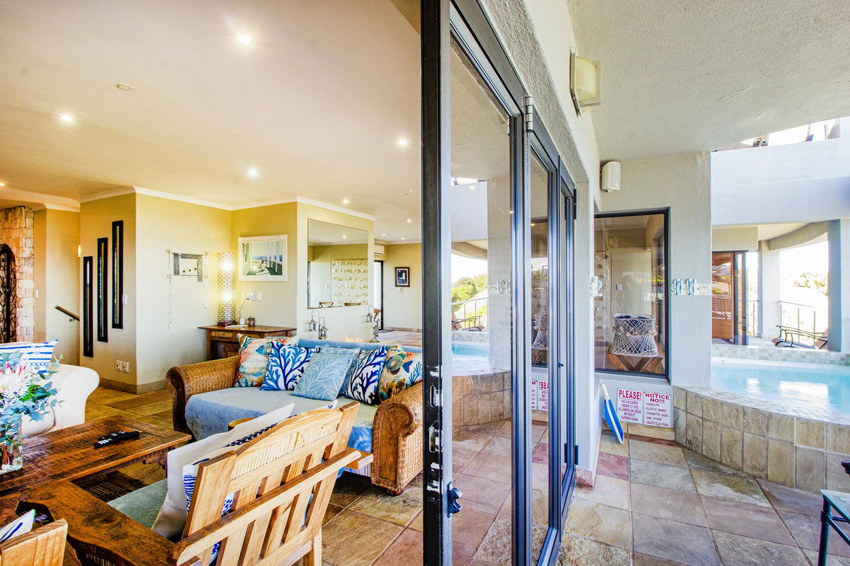Looking from the lounge through to the stoep and Walker Bay