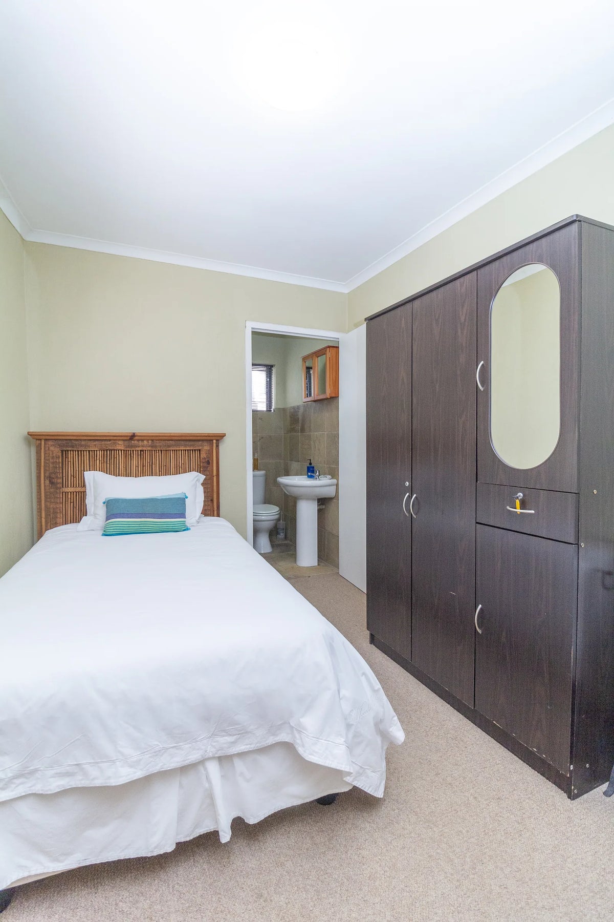 Single Room 1 with its wardrobe and door