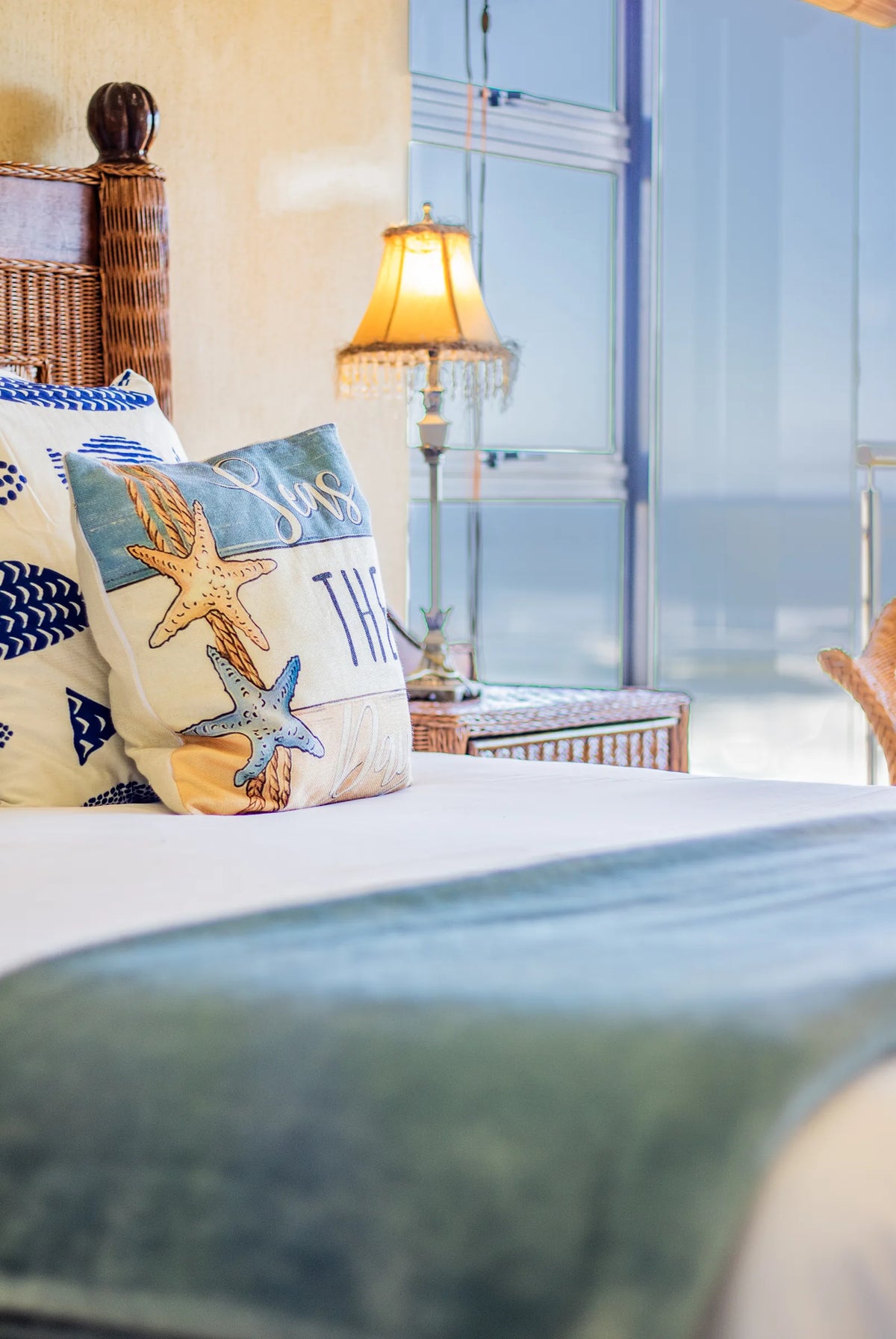 The sea framed by a bedroom window
